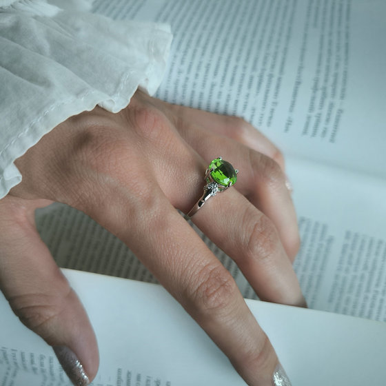 Silver ring with a 3.397-carat chrysolite and cubic zirconia
