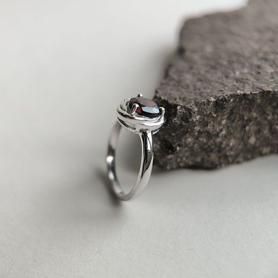 Silver ring with a garnet