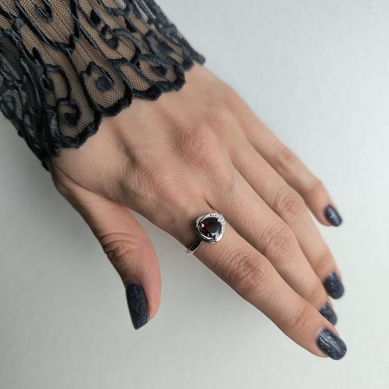 Silver ring with a garnet