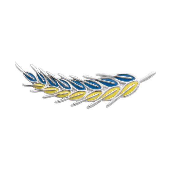 A silver brooch with semallu