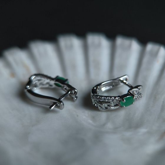 Silver earrings with emerald, fianites