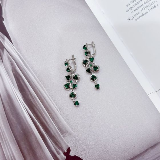 Silver earrings with a 3.452-carat nano emerald