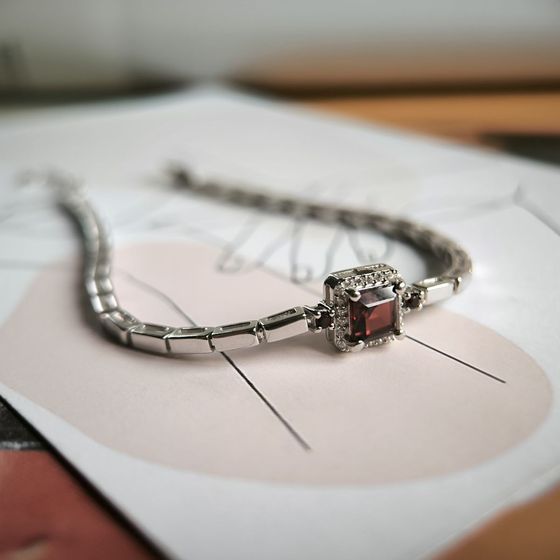 Silver bracelet with a garnet
