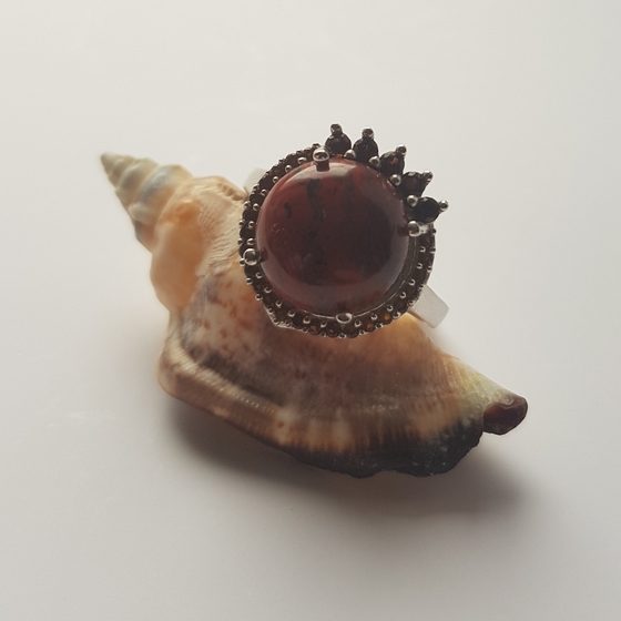 Silver ring with white topaz.