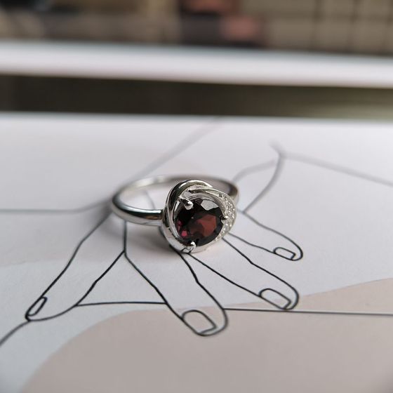 Silver ring with a garnet