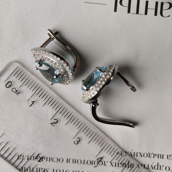 Silver earrings with a 5.607-carat topaz and cubic zirconia