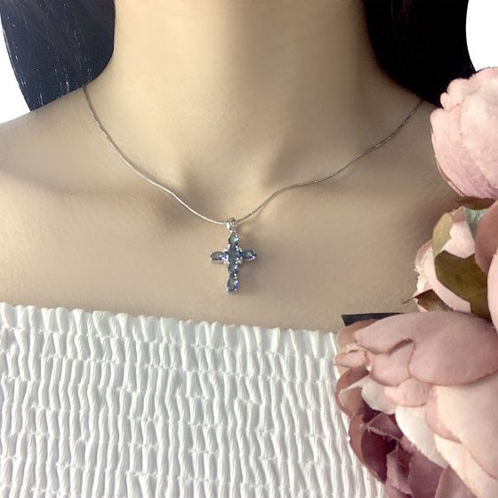 Silver cross with mystic topaz.