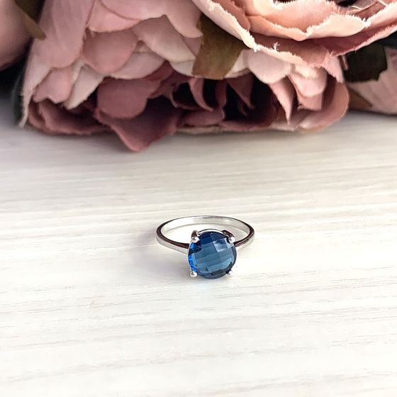Silver ring with topaz London Blue