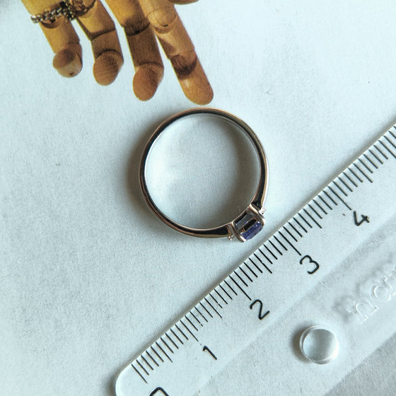 Silver ring with a 0.444-carat sapphire and cubic zirconia