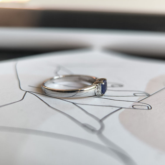 Silver ring with a 0.444-carat sapphire and cubic zirconia