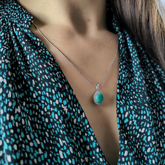 Silver pendant with 2.699ct emerald and cubic zirconia