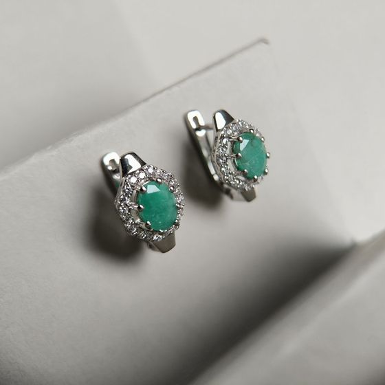 Silver earrings with emerald, fianites