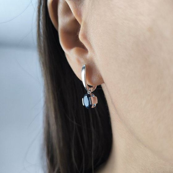 Silver earrings with a 1.825-carat nano sapphire