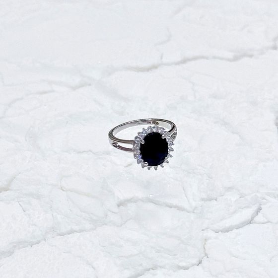 Silver ring with a sapphire and cubic zirconia