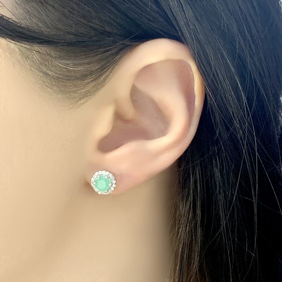 Silver earrings with a 1.259-carat emerald