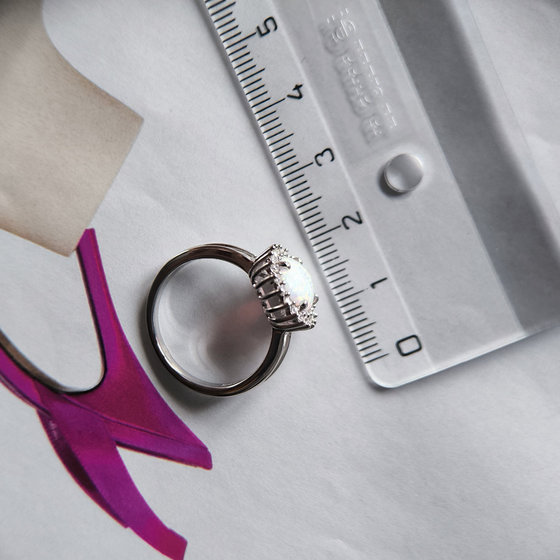 Silver ring with a 1.265-carat opal and cubic zirconia
