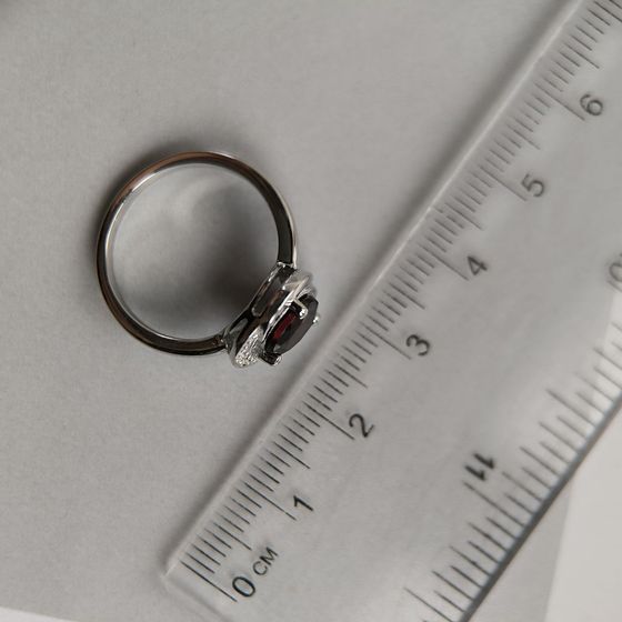 Silver ring with a garnet