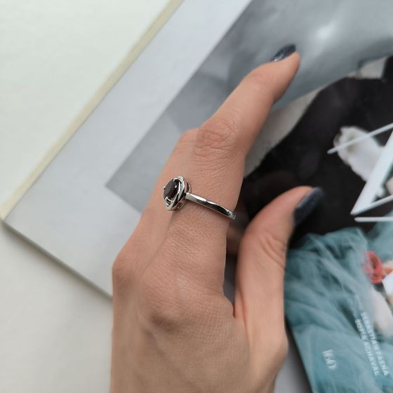 Silver ring with a garnet