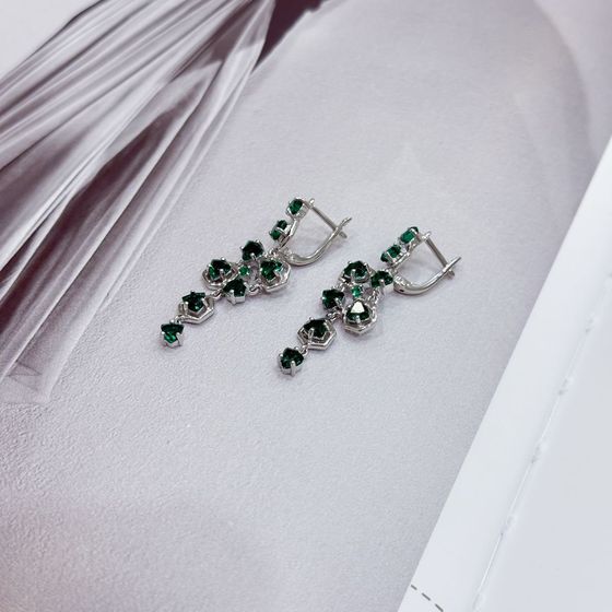 Silver earrings with a 3.452-carat nano emerald