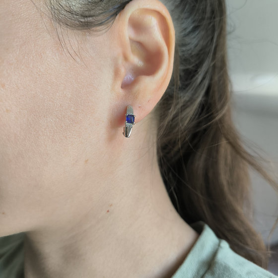 Silver earrings with a 0.889-carat sapphire and cubic zirconia