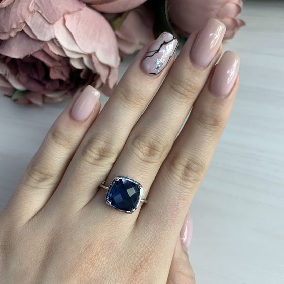 Silver ring with topaz London Blue
