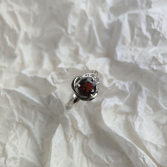 Silver ring with a garnet