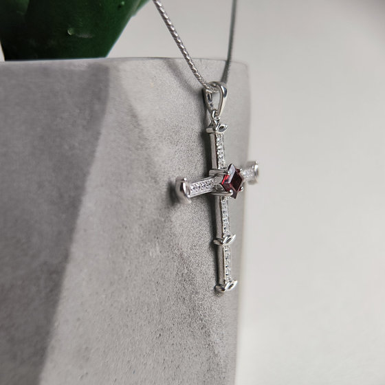 Silver cross with 1.37ct garnet and cubic zirconia