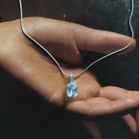 Silver pendant with a topaz and cubic zirconia