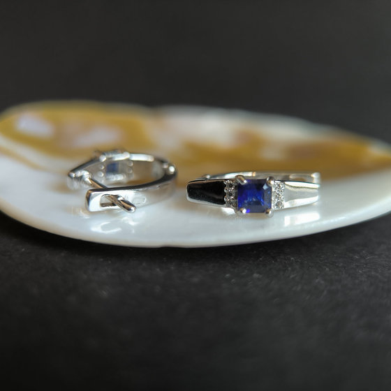 Silver earrings with a 0.889-carat sapphire and cubic zirconia
