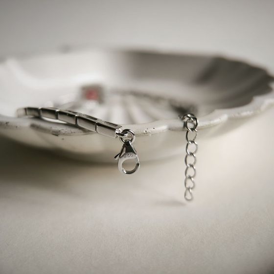 Silver bracelet with a garnet