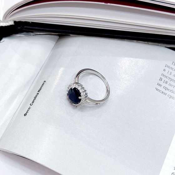 Silver ring with a sapphire and cubic zirconia