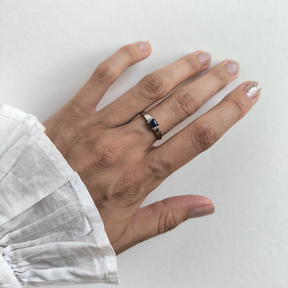 Silver ring with a 0.444-carat sapphire and cubic zirconia