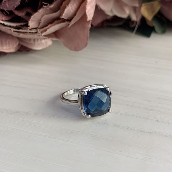 Silver ring with topaz London Blue
