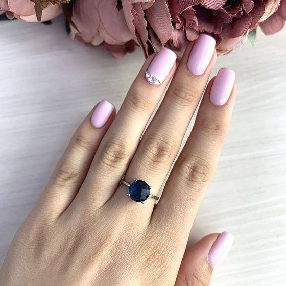 Silver ring with topaz London Blue