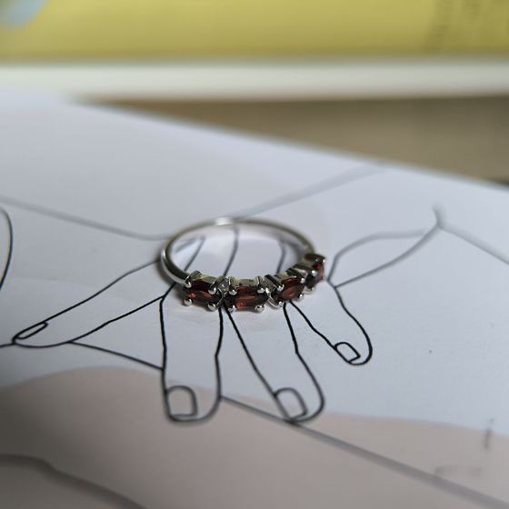 Silver ring with a garnet